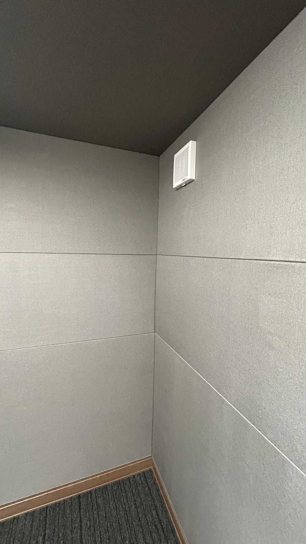 Interior view of soundproof booth (acoustic finishing, ventilation grille)