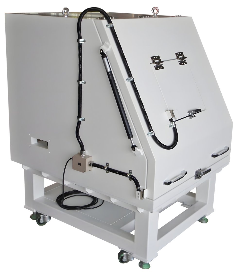 Wing-door soundproof box where the inclined front face opens together with the top door. Gas damper on the side, latch and handle on front, mounted on a frame with casters.